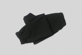 Warm unisex black trousers have a pocket