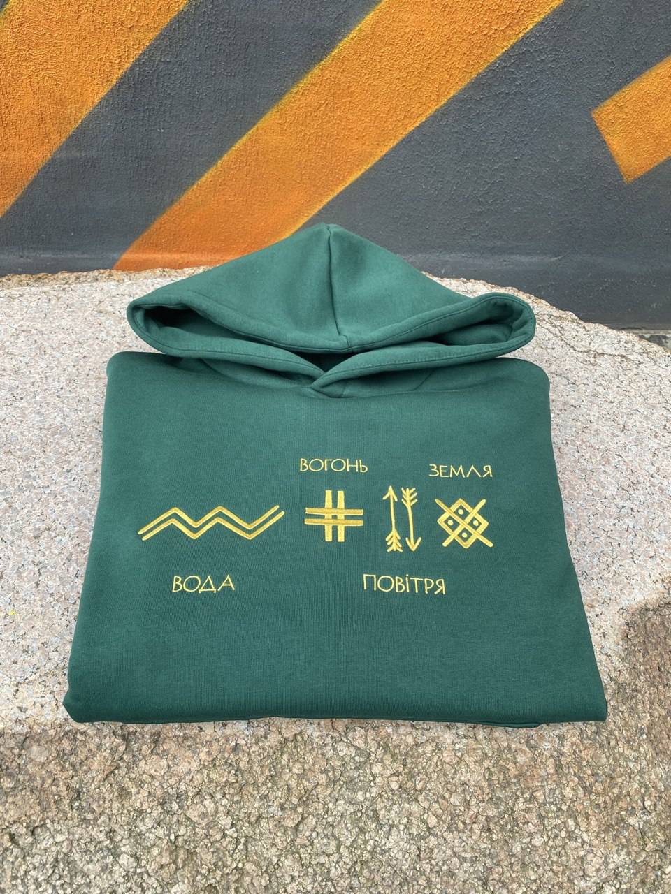 Green hoodie with embroidery of runes