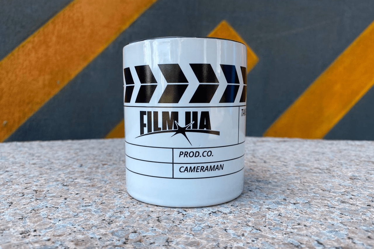 Black-and-white cup Film.Ua with clapboard