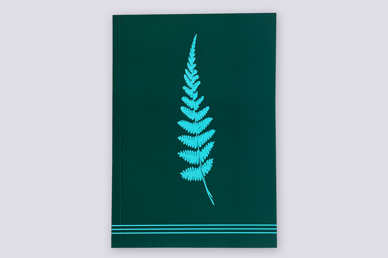 Green notebook with the image of Fern